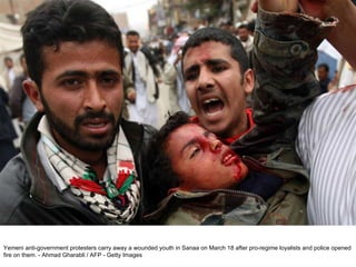 Yemeni anti-government protesters carry away a wounded youth in Sanaa on March 18 after pro-regime loyalists and police opened fire on them. - Ahmad Gharabli / AFP - Getty Images  