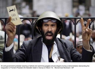 An anti-government protester wearing a helmet and swimming goggles shouts slogans during a demonstration demanding the resignation of Yemeni President Ali Abdullah Saleh in Sanaa on March 18. - Muhammed Muheisen / AP  