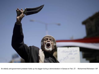 An elderly anti-government protester holds up his dagger during a demonstration in Sanaa on Feb. 27.  - Muhammed Muheisen / AP  