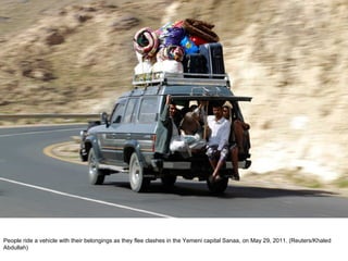 People ride a vehicle with their belongings as they flee clashes in the Yemeni capital Sanaa, on May 29, 2011. (Reuters/Khaled Abdullah)  