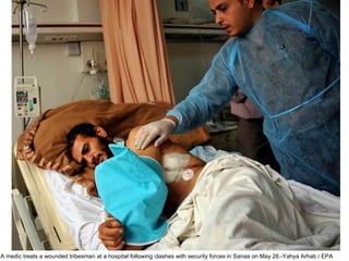 A medic treats a wounded tribesman at a hospital following clashes with security forces in Sanaa on May 26.-Yahya Arhab / EPA  