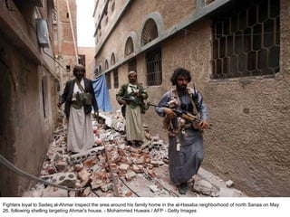 Fighters loyal to Sadeq al-Ahmar inspect the area around his family home in the al-Hasaba neighborhood of north Sanaa on May 26, following shelling targeting Ahmar's house. - Mohammed Huwais / AFP - Getty Images  