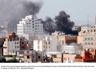 Smoke rises during clashes between police forces and armed tribesmen loyal to tribal leader Shiekh Sadiq al-Ahmar near his house in Sanaa, on May 24, 2011. (Reuters/Stringer)  