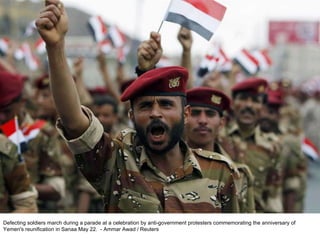 Defecting soldiers march during a parade at a celebration by anti-government protesters commemorating the anniversary of Yemen's reunification in Sanaa May 22.  - Ammar Awad / Reuters  