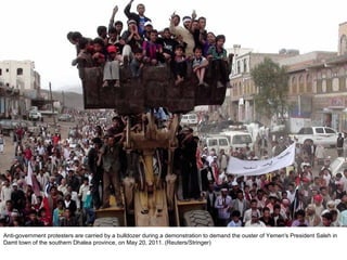 Anti-government protesters are carried by a bulldozer during a demonstration to demand the ouster of Yemen's President Saleh in Damt town of the southern Dhalea province, on May 20, 2011. (Reuters/Stringer)  