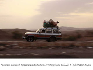 People ride in a vehicle with their belongings as they flee fighting in the Yemeni capital Sanaa, June 4. - Khaled Abdullah / Reuters  