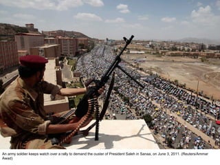 An army soldier keeps watch over a rally to demand the ouster of President Saleh in Sanaa, on June 3, 2011. (Reuters/Ammar Awad)  