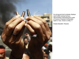 An anti-government protester displays spent bullet casings during a demonstration demanding the ouster of Yemen's President Ali Abdullah Saleh in Taiz, Yemen on May 11 Khaled Abdullah / Reuters  