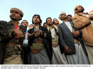 Anti-government protesters chew qat as they stand with their daggers during a rally to demand the ouster of Yemen's President Ali Abdullah Saleh in Sanaa on May 10. - Ahmed Jadallah / Reuters  
