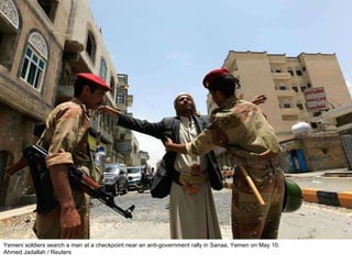 Yemeni soldiers search a man at a checkpoint near an anti-government rally in Sanaa, Yemen on May 10. Ahmed Jadallah / Reuters  