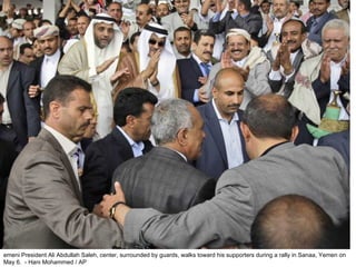 emeni President Ali Abdullah Saleh, center, surrounded by guards, walks toward his supporters during a rally in Sanaa, Yemen on May 6.  - Hani Mohammed / AP  