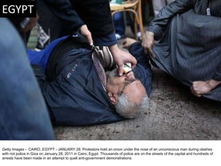 Getty Images -  CAIRO, EGYPT - JANUARY 28: Protestors hold an onion under the nose of an unconscious man during clashes wi...