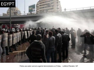 Police use water cannons against demonstrators on Friday.  - Lefteris Pitarakis / AP  
