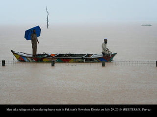Pakistani villagers move to high ground escaping a flood-hit village near Nowshera, Pakistan on Thursday, July 29,
2010. (...
