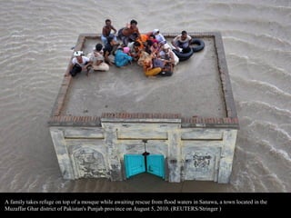 A man tries to cross a makeshift bridge to escape his flooded home in Nowshera, Pakistan on July 31, 2010.
(REUTERS/Adrees...