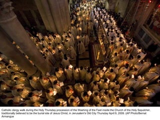 Catholic clergy walk during the Holy Thursday procession of the Washing of the Feet inside the Church of the Holy Sepulcher, traditionally believed to be the burial site of Jesus Christ, in Jerusalem's Old City Thursday April 9, 2009. (AP Photo/Bernat Armangue  