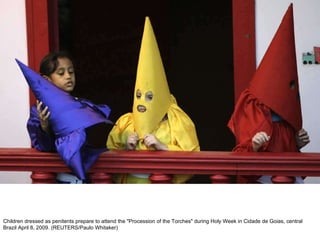 Children dressed as penitents prepare to attend the "Procession of the Torches" during Holy Week in Cidade de Goias, central Brazil April 8, 2009. (REUTERS/Paulo Whitaker)  