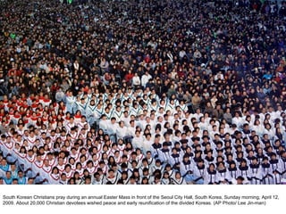 South Korean Christians pray during an annual Easter Mass in front of the Seoul City Hall, South Korea, Sunday morning, April 12, 2009. About 20,000 Christian devotees wished peace and early reunification of the divided Koreas. (AP Photo/ Lee Jin-man)  