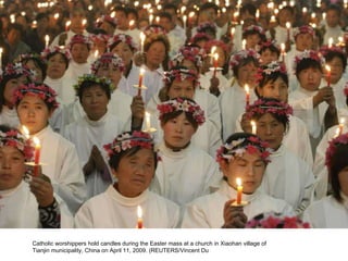 Catholic worshippers hold candles during the Easter mass at a church in Xiaohan village of Tianjin municipality, China on April 11, 2009. (REUTERS/Vincent Du  