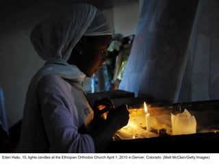 Eden Hailu, 10, lights candles at the Ethiopian Orthodox Church April 1, 2010 in Denver, Colorado. (Matt McClain/Getty Images)  