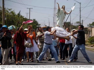 Faithful carry a statue of Jesus Christ during an Easter Sunday procession in El Crucero, Nicaragua on Sunday. (AP Photo/Esteban Felix)  