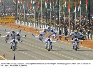 Indian Border Security Force (BSF) soldiers perform motorcycle stunts during the Republic Day parade in New Delhi on January 26,
2011. AFP/ Getty Images / Raveedran
 