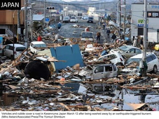 Vehicles and rubble cover a road in Kesennuma Japan March 12 after being washed away by an earthquake-triggered tsunami. (Miho Iketani/Associated Press/The Yomiuri Shimbum  