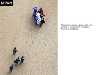 Rescue workers carry a quake victim on a stretcher in Miyako March 12. (Kyodo News/Associated Press  