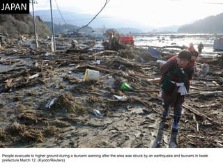 People evacuate to higher ground during a tsunami warning after the area was struck by an earthquake and tsunami in Iwate prefecture March 12. (Kyodo/Reuters)  
