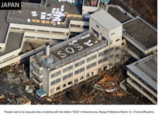 People wait to be rescued atop a building with the letters "SOS" in Kesennuma, Miyagi Prefecture March 12. (Yomiuri/Reuters)  