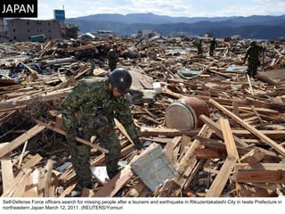 Self-Defense Force officers search for missing people after a tsunami and earthquake in Rikuzentakatashi City in Iwate Prefecture in northeastern Japan March 12, 2011. (REUTERS/Yomiuri  