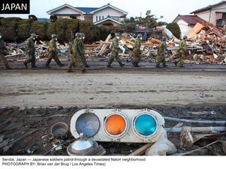 Sendai, Japan — Japanese soldiers patrol through a devastated Natori neighborhood. PHOTOGRAPH BY: Brian van der Brug / Los Angeles Times)  