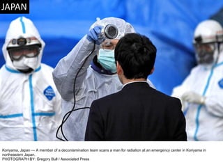 Koriyama, Japan — A member of a decontamination team scans a man for radiation at an emergency center in Koriyama in northeastern Japan. PHOTOGRAPH BY: Gregory Bull / Associated Press 