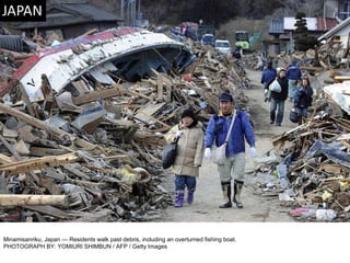 Minamisanriku, Japan — Residents walk past debris, including an overturned fishing boat. PHOTOGRAPH BY: YOMIURI SHIMBUN / AFP / Getty Images 