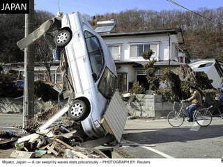 Miyako, Japan — A car swept by waves rests precariously. - PHOTOGRAPH BY: Reuters 