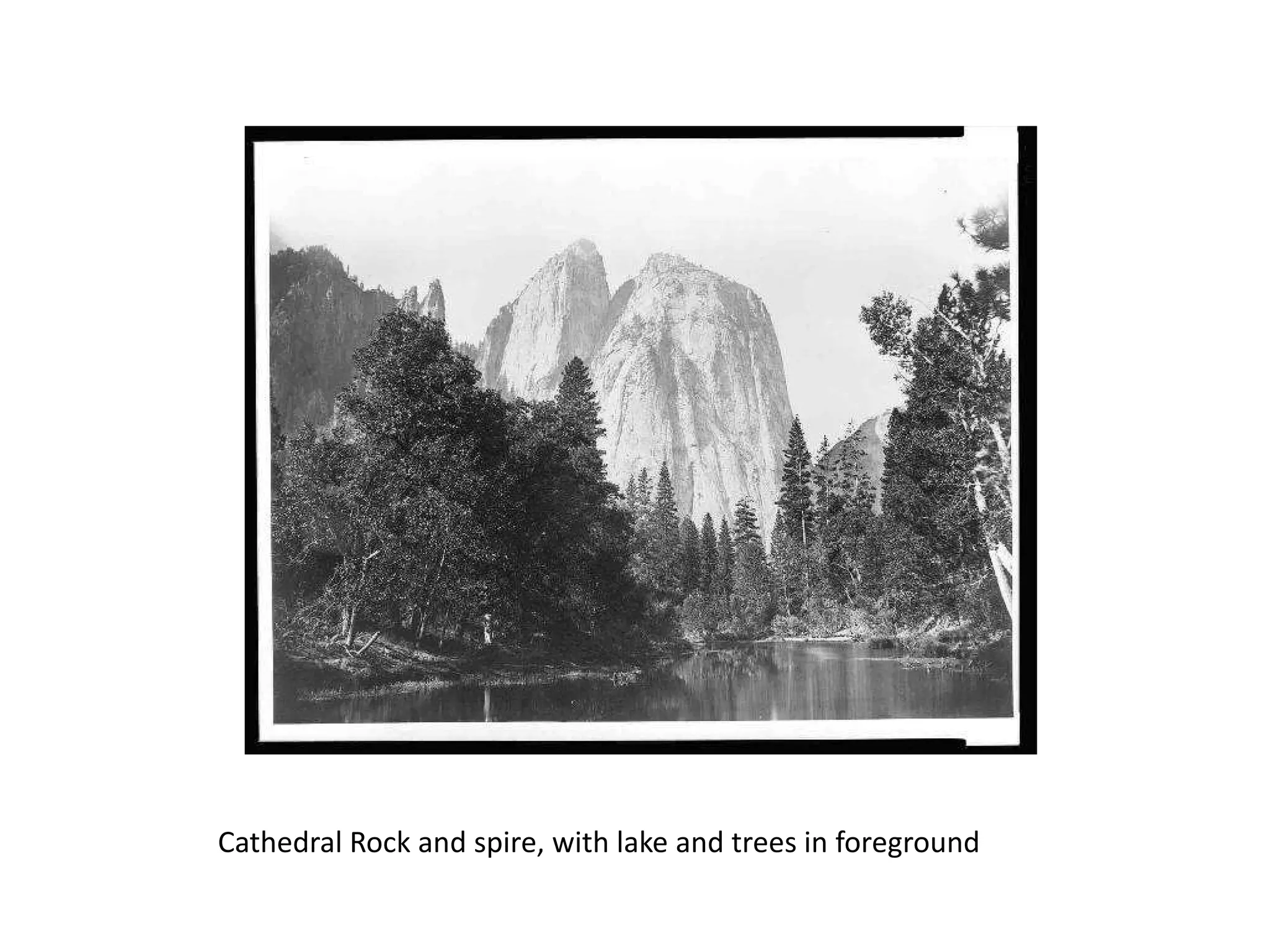 Cathedral Rock and spire, with lake and trees in foreground

 