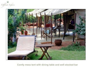 Comfy mess tent with dining table and well stocked bar 