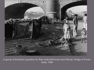 A group of homeless squatters by their makeshift tents near Shivaji  bridge at Poona. India. 1948