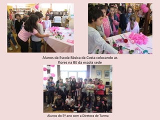 Alunos do 5º ano com a Diretora de Turma
Alunos da Escola Básica da Costa colocando as
flores na BE da escola sede
 