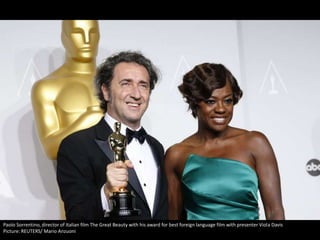 Paolo Sorrentino, director of Italian film The Great Beauty with his award for best foreign language film with presenter Viola Davis
Picture: REUTERS/ Mario Anzuoni

 