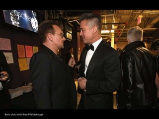 Bono chats with Brad Pitt backstage

 