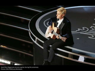 Host Ellen Degeneres strums a guitar during the ceremony
Picture: REUTERS/Lucy Nicholson

 