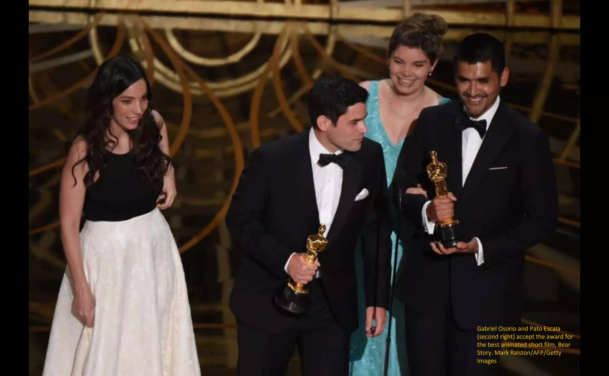 Gabriel Osorio and Pato Escala
(second right) accept the award for
the best animated short film, Bear
Story. Mark Ralston/AFP/Getty
Images
 