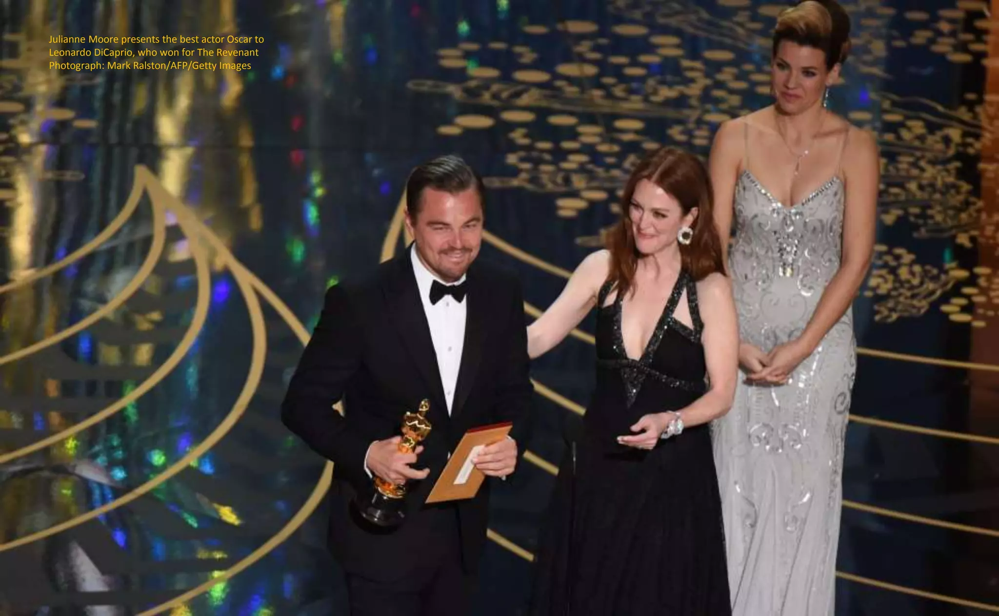 Julianne Moore presents the best actor Oscar to
Leonardo DiCaprio, who won for The Revenant
Photograph: Mark Ralston/AFP/Getty Images
 