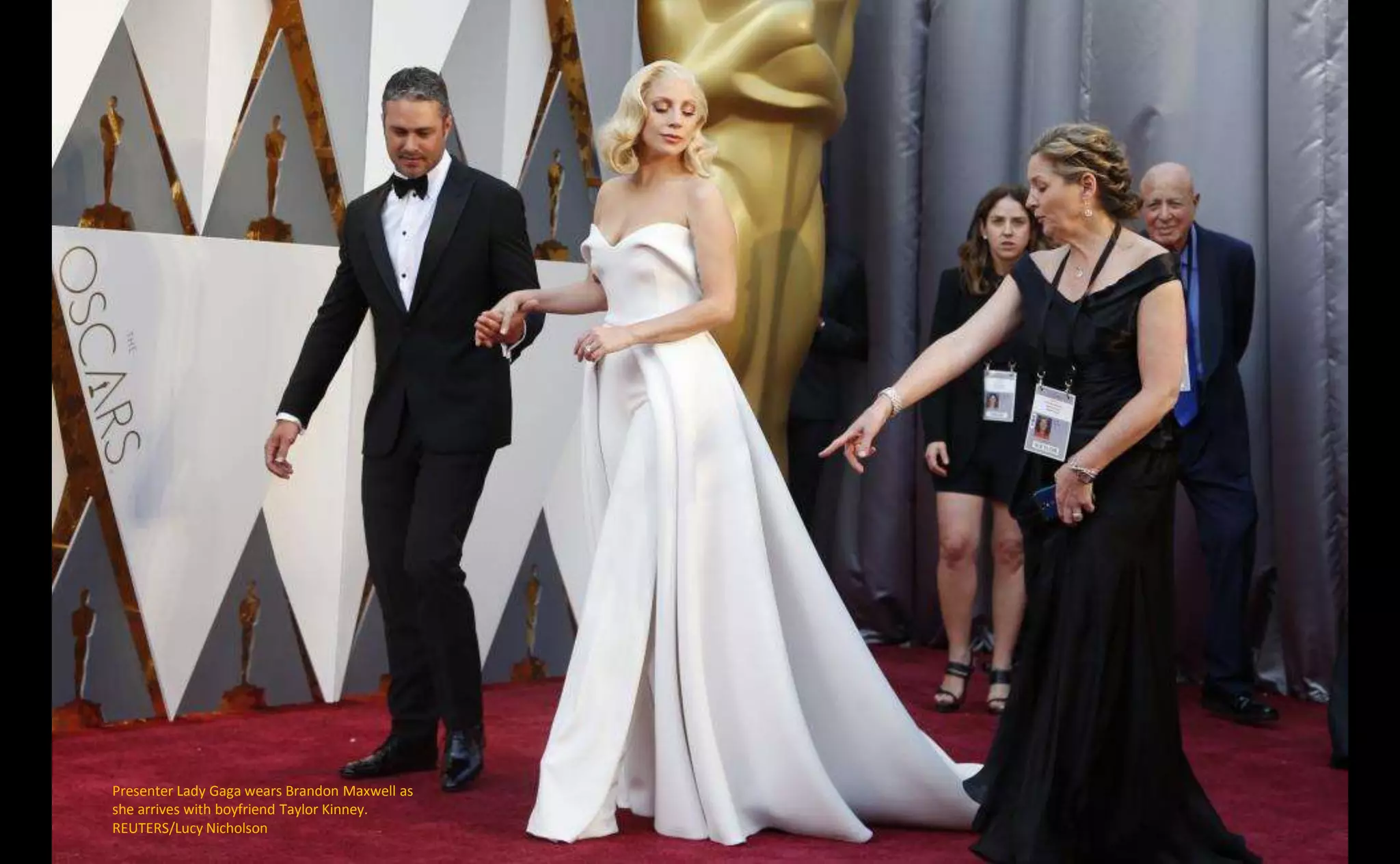 Presenter Lady Gaga wears Brandon Maxwell as
she arrives with boyfriend Taylor Kinney.
REUTERS/Lucy Nicholson
 