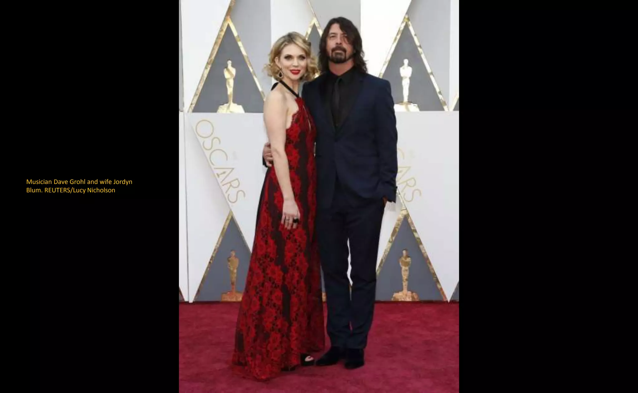 Musician Dave Grohl and wife Jordyn
Blum. REUTERS/Lucy Nicholson
 