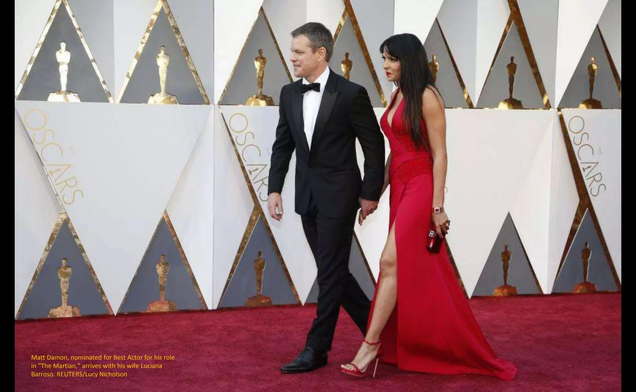 Matt Damon, nominated for Best Actor for his role
in "The Martian," arrives with his wife Luciana
Barroso. REUTERS/Lucy Nicholson
 