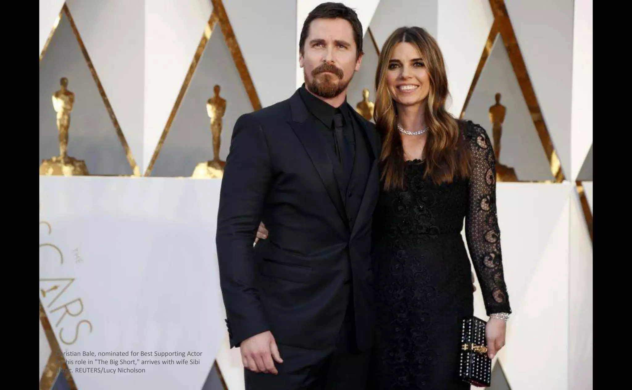 Christian Bale, nominated for Best Supporting Actor
for his role in "The Big Short," arrives with wife Sibi
Blazic. REUTERS/Lucy Nicholson
 