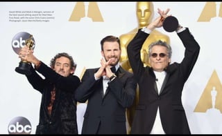 David White and Mark A Mangini, winners of
the best sound editing award for Mad Max:
Fury Road, with the actor Chris Evans (centre)
Photograph: Jason Merritt/Getty Images
 