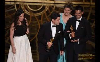 Gabriel Osorio and Pato Escala
(second right) accept the award for
the best animated short film, Bear
Story. Mark Ralston/AFP/Getty
Images
 